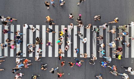 Aerial shot of people on a pedestrian crossing. Image by Varavin88 via Shutterstock