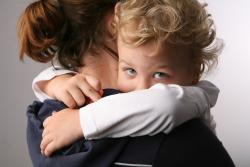 child with mother via Shutterstock 
